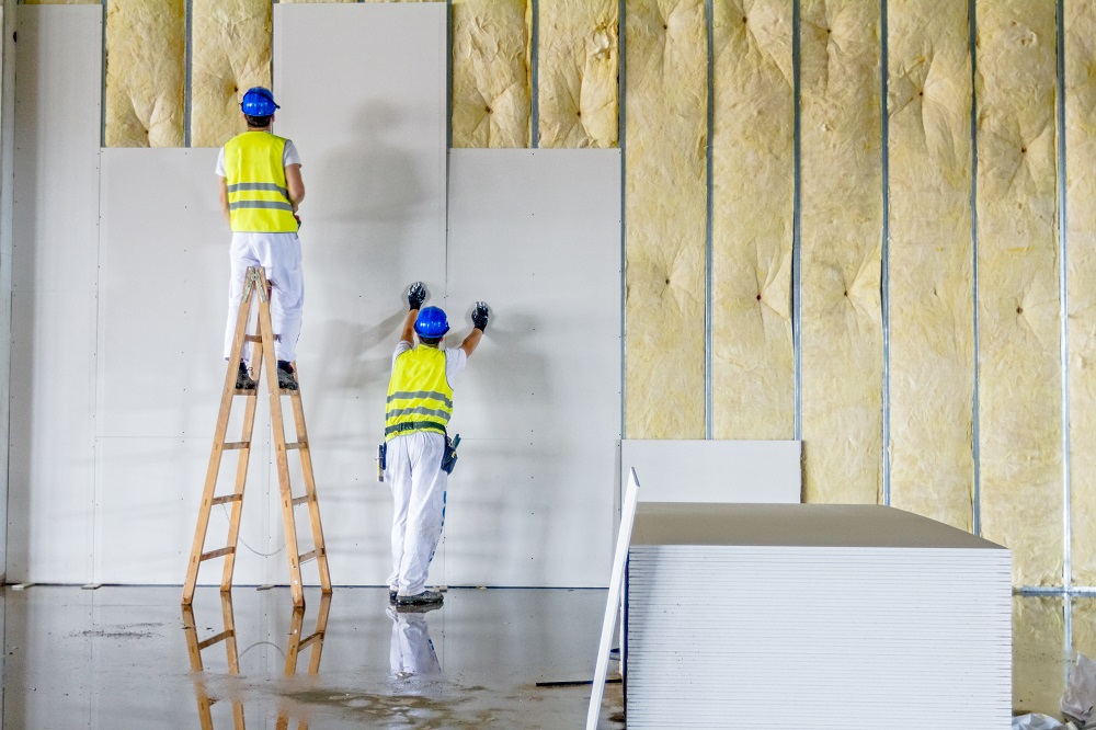 men installing wall panels