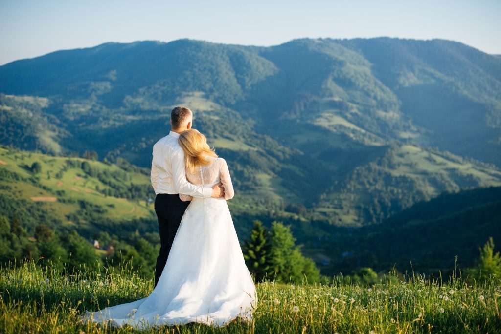 Young love couple celebrating a wedding in the mountains