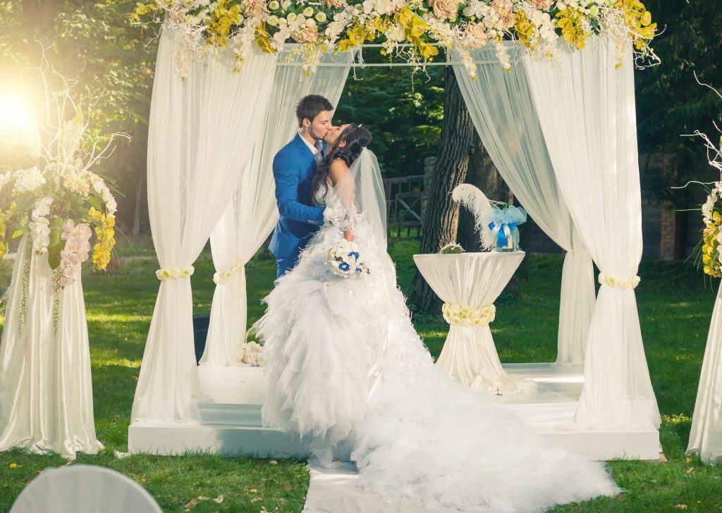 A couple getting married in a garden