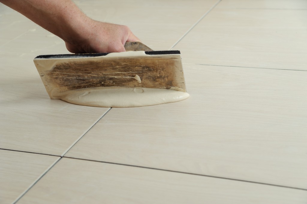 putting grout on tiles