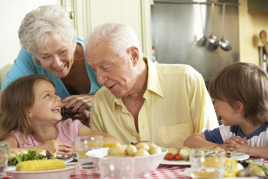 grandparents having lunch with their grandkids