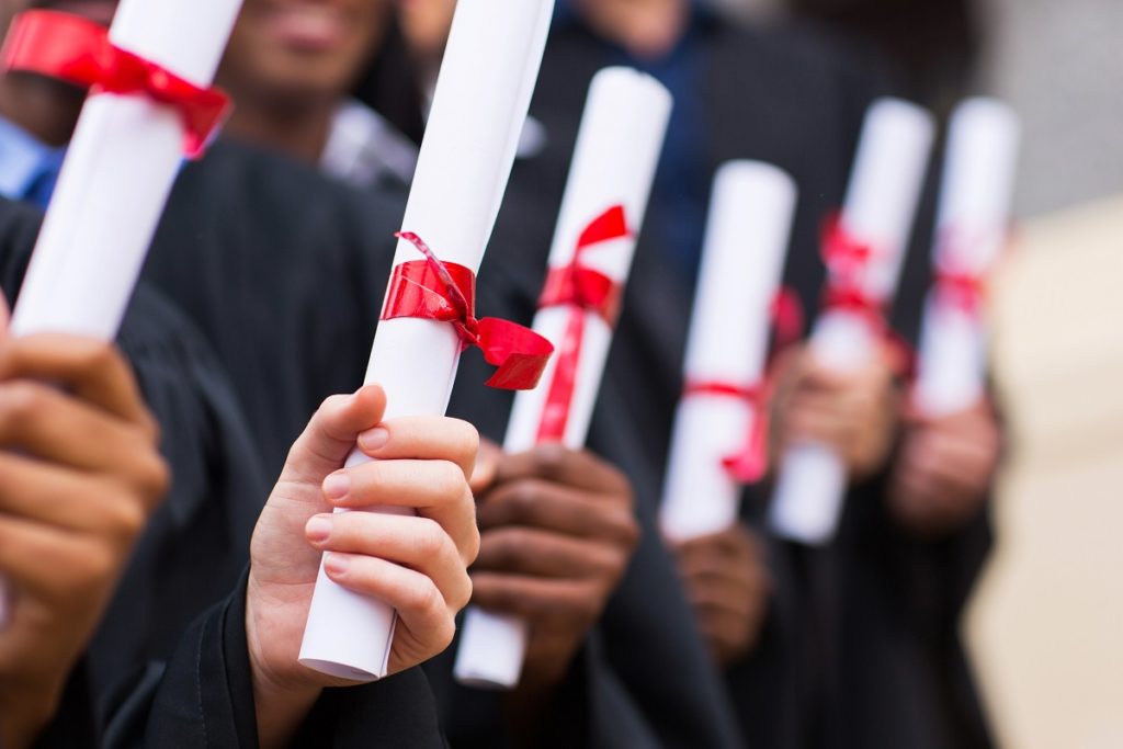 college graduates holding diploma