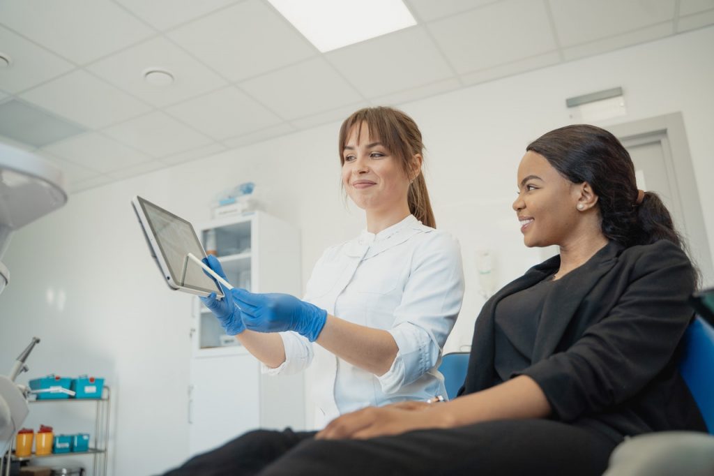 dentist explaining to patient