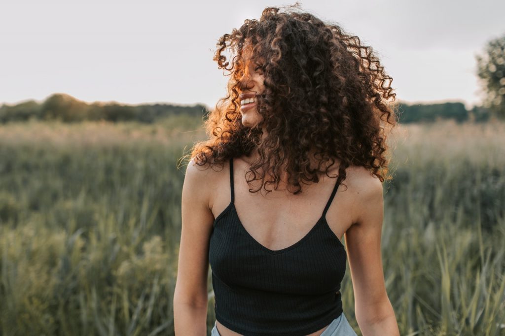 woman smiling on a field