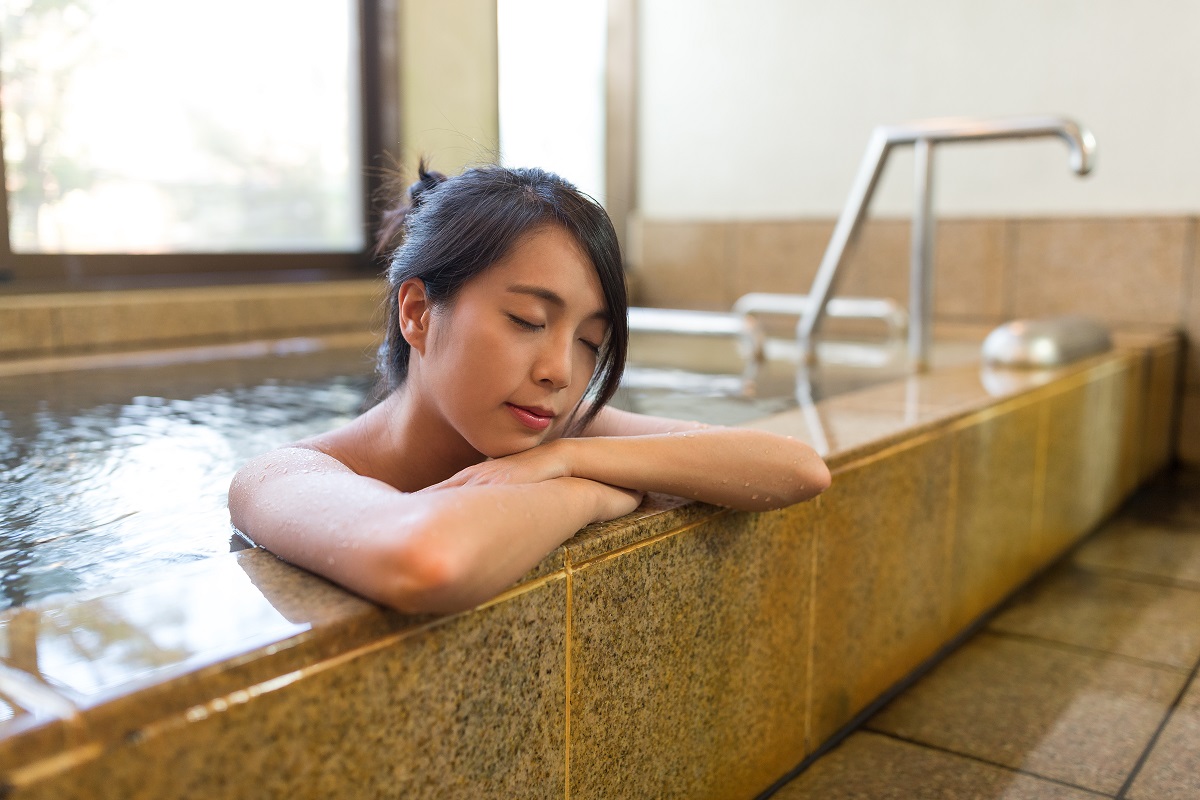 woman relaxing on a bathtub