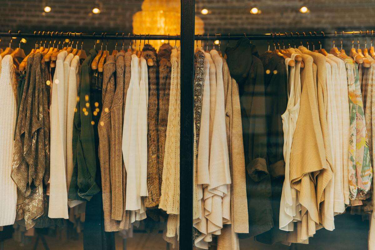rack full of neutral color clothes