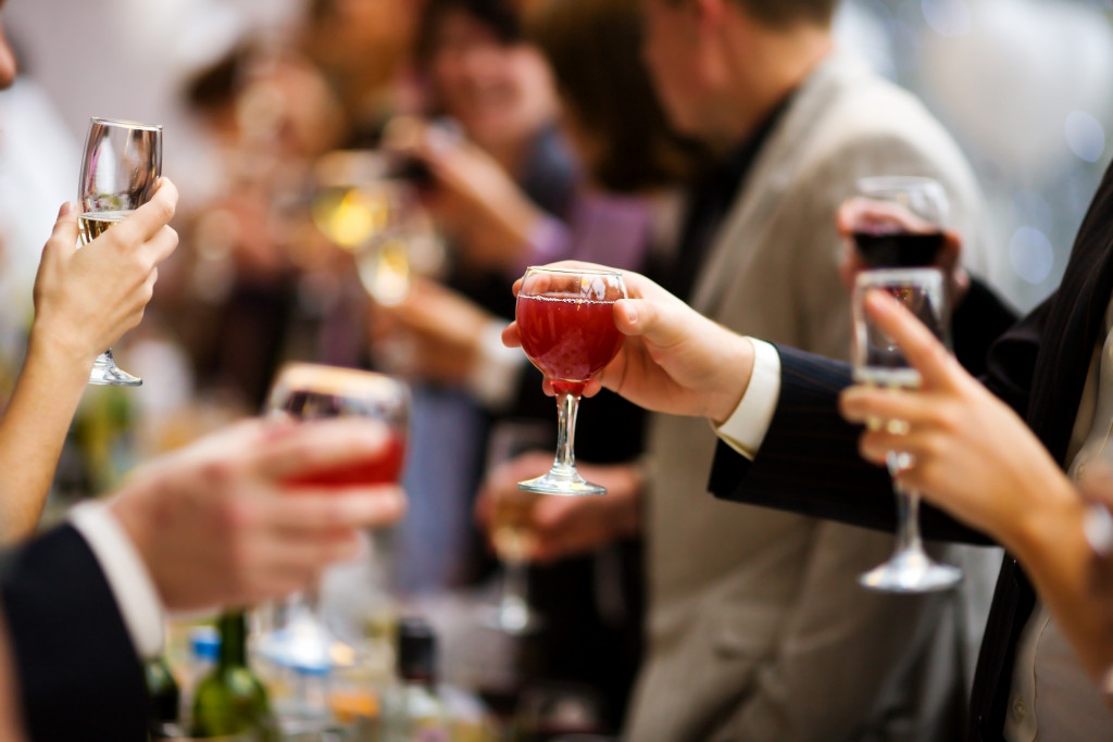people with wine glasses at a lucury event