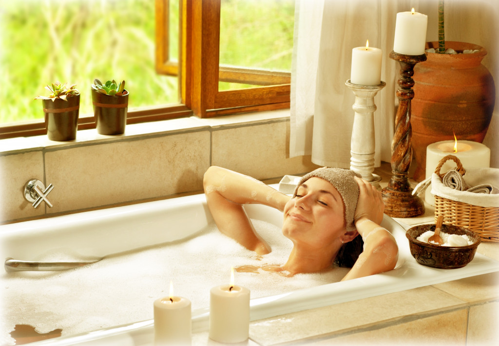 woman relaxing in a bathtub at home