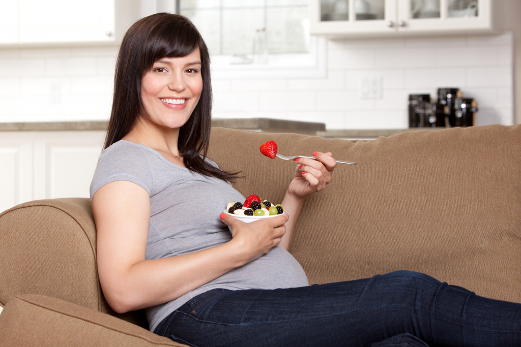 A pregnant woman eating healthily